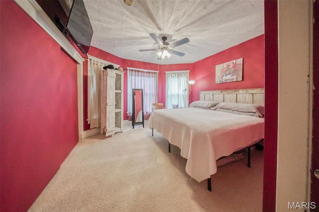 bedroom with carpet flooring and a ceiling fan