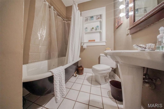 full bathroom featuring tile patterned flooring, toilet, and shower / bathtub combination with curtain