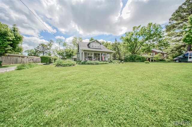 view of yard featuring a porch