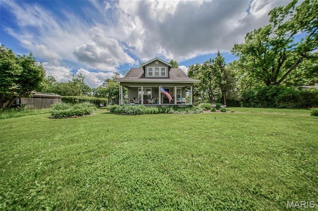 rear view of property featuring a porch