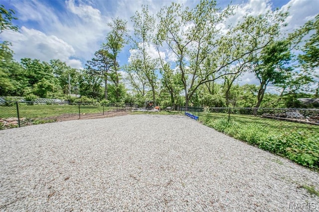 view of property's community with fence