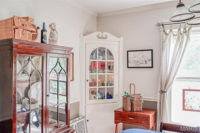 doorway featuring crown molding