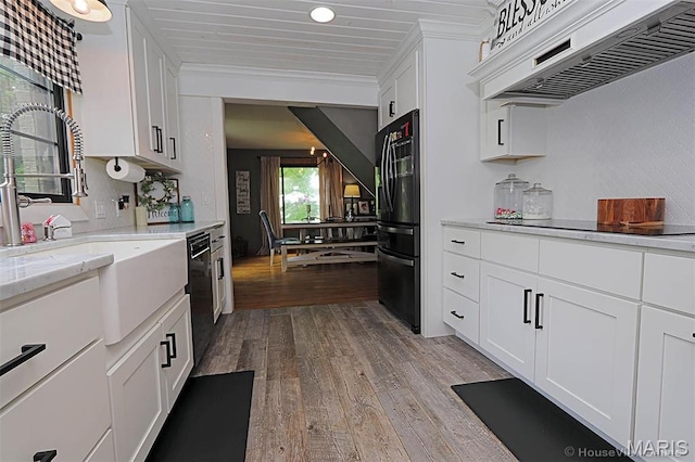 2754 Adeline Ave, Cape Girardeau, MO 63701 - kitchen featuring premium range hood, hardwood / wood-style floors, black appliances, white cabinetry, and crown molding