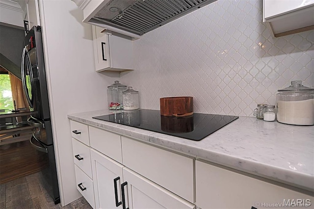 2754 Adeline Ave, Cape Girardeau, MO 63701 - kitchen featuring custom range hood, dark wood-style flooring, white cabinetry, freestanding refrigerator, and black electric cooktop