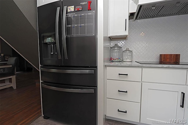 2754 Adeline Ave, Cape Girardeau, MO 63701 - kitchen with black appliances, custom exhaust hood, white cabinets, dark wood-style flooring, and decorative backsplash