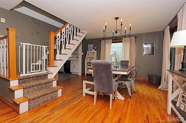 2754 Adeline Ave, Cape Girardeau, MO 63701 - dining space with a chandelier, stairs, and wood finished floors