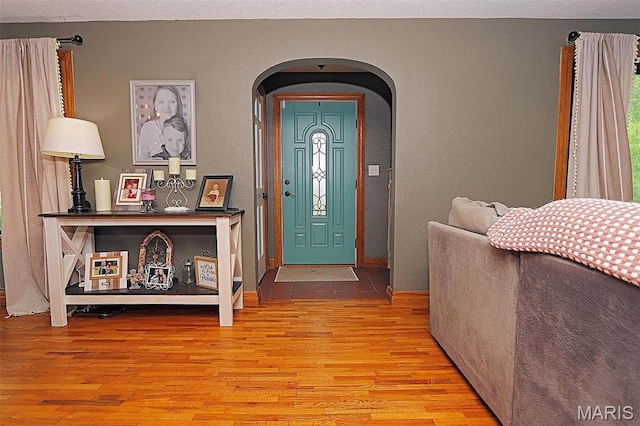 2754 Adeline Ave, Cape Girardeau, MO 63701 - foyer entrance featuring arched walkways, wood finished floors, and a textured wall
