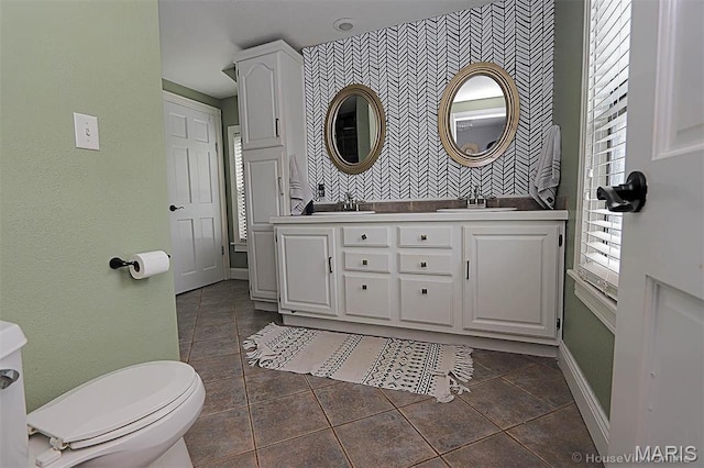 2754 Adeline Ave, Cape Girardeau, MO 63701 - full bath featuring an accent wall, double vanity, and wallpapered walls