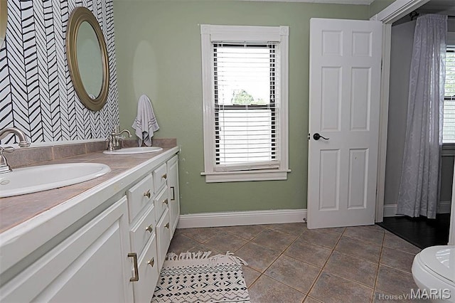 2754 Adeline Ave, Cape Girardeau, MO 63701 - full bathroom featuring double vanity and plenty of natural light