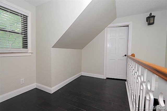 2754 Adeline Ave, Cape Girardeau, MO 63701 - bonus room featuring lofted ceiling, a textured ceiling, and dark wood finished floors