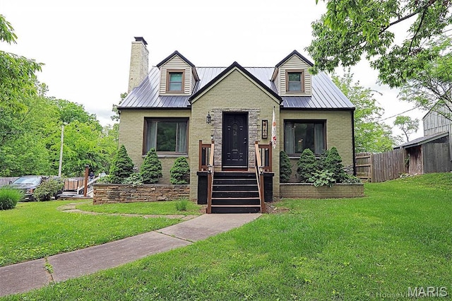 2754 Adeline Ave, Cape Girardeau, MO 63701 - view of front facade featuring a chimney, a metal roof, brick siding, and a standing seam roof