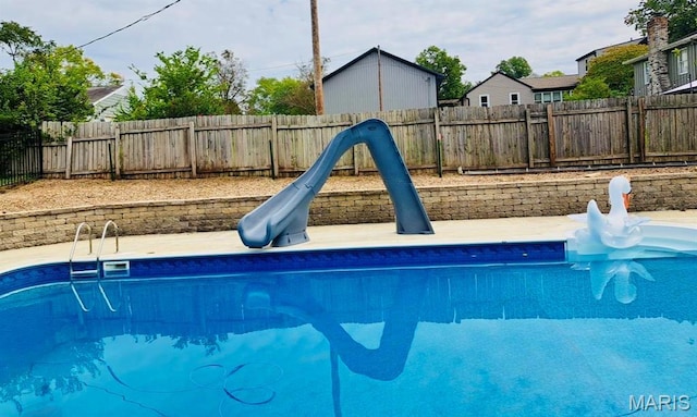 2754 Adeline Ave, Cape Girardeau, MO 63701 - view of swimming pool with a water slide and a fenced backyard