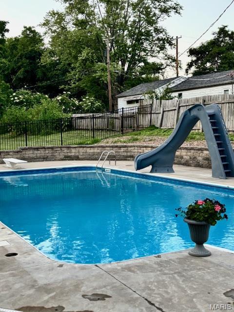 2754 Adeline Ave, Cape Girardeau, MO 63701 - view of pool with a water slide and a fenced backyard
