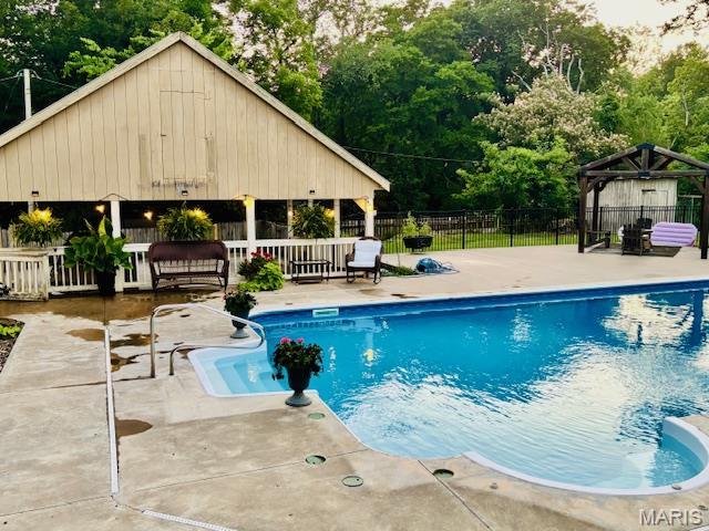 2754 Adeline Ave, Cape Girardeau, MO 63701 - view of pool with a gazebo, a patio area, and view of wooded area