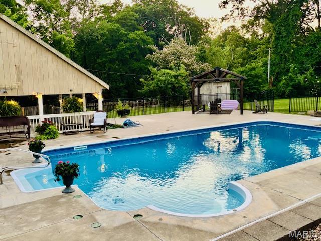2754 Adeline Ave, Cape Girardeau, MO 63701 - view of pool with a gazebo, a patio, and view of wooded area