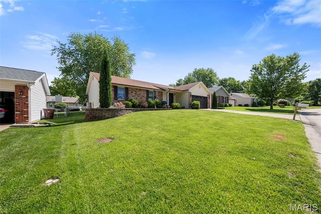 324 Trailview Ave, Saint Peters, MO 63376 - ranch-style house with a front lawn, a garage, driveway, and brick siding