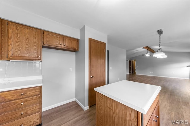 324 Trailview Ave, Saint Peters, MO 63376 - kitchen with brown cabinets, dark wood finished floors, decorative backsplash, and light countertops