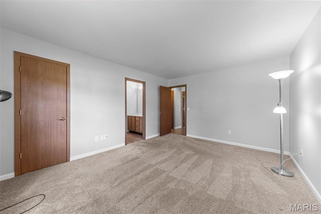 324 Trailview Ave, Saint Peters, MO 63376 - unfurnished bedroom with carpet floors, baseboards, and connected bathroom