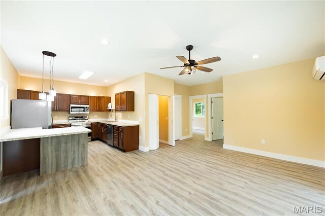 408 E Roosevelt, Salem, MO 65560 - kitchen with appliances with stainless steel finishes, light countertops, baseboards, a ceiling fan, and light wood-style floors