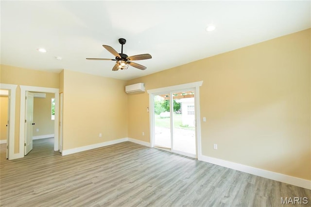 408 E Roosevelt, Salem, MO 65560 - unfurnished room featuring a wall mounted air conditioner, ceiling fan, light wood-style flooring, baseboards, and recessed lighting
