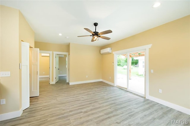 408 E Roosevelt, Salem, MO 65560 - unfurnished room featuring an AC wall unit, baseboards, light wood finished floors, recessed lighting, and a ceiling fan