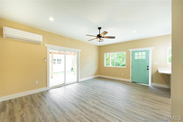 408 E Roosevelt, Salem, MO 65560 - unfurnished living room featuring an AC wall unit, ceiling fan, wood finished floors, baseboards, and recessed lighting