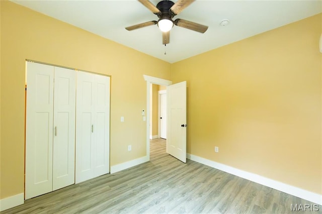 408 E Roosevelt, Salem, MO 65560 - unfurnished bedroom featuring light wood-type flooring, baseboards, a closet, and ceiling fan