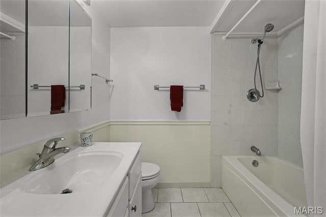 bathroom featuring tile patterned flooring, toilet, vanity, and shower / bath combo