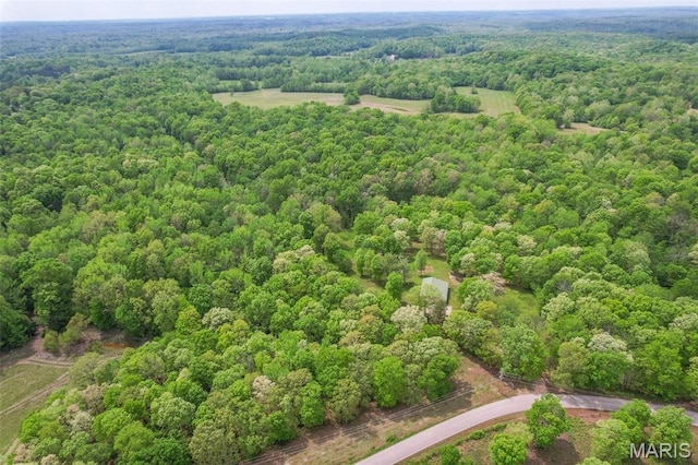 drone / aerial view of a heavily wooded area