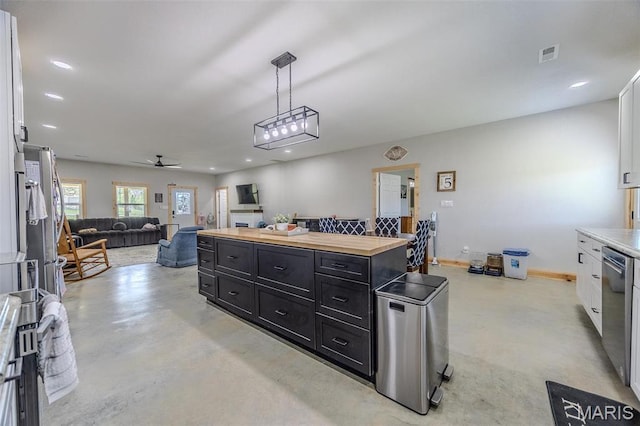22950 Pin Oak Dr, Lebanon, MO 65536 - kitchen with butcher block counters, dark cabinetry, finished concrete floors, white cabinetry, and recessed lighting