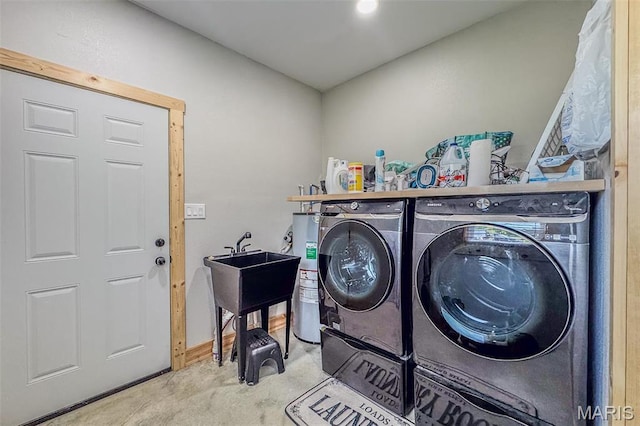 22950 Pin Oak Dr, Lebanon, MO 65536 - laundry room featuring washing machine and clothes dryer, carpet, water heater, and baseboards