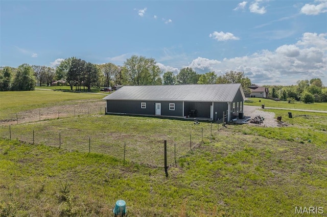 22950 Pin Oak Dr, Lebanon, MO 65536 - rear view of house with an outbuilding and metal roof