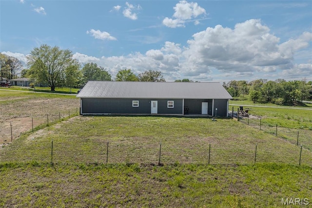 22950 Pin Oak Dr, Lebanon, MO 65536 - back of property with an outbuilding, metal roof, and a view of countryside