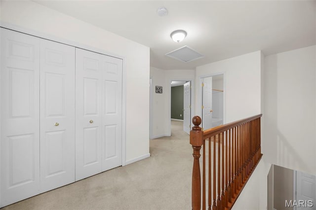 554 Springhurst Pkwy, Ofallon, MO 63368 - hallway with light carpet, an upstairs landing, and baseboards