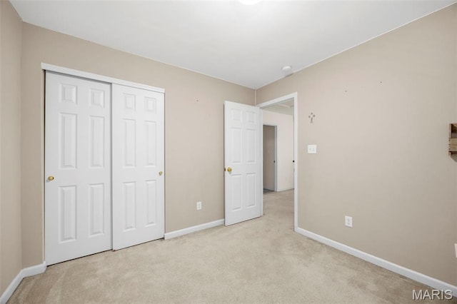 554 Springhurst Pkwy, Ofallon, MO 63368 - unfurnished bedroom featuring light carpet, baseboards, and a closet