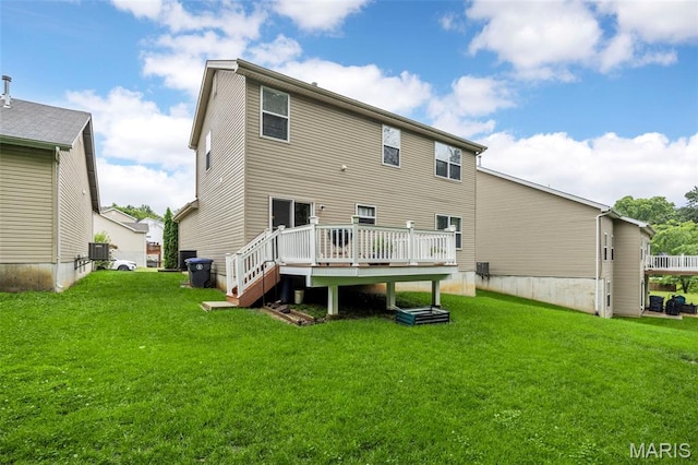 554 Springhurst Pkwy, Ofallon, MO 63368 - rear view of property with a wooden deck, a lawn, and central air condition unit