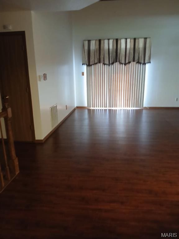 10506 Camden Park Dr, Saint Louis, MO 63135 - spare room featuring wood finished floors and baseboards