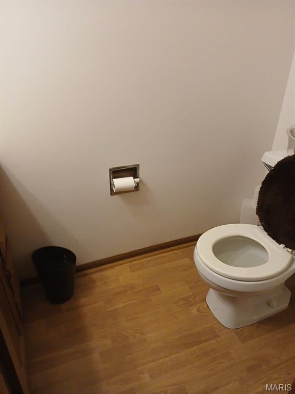 10506 Camden Park Dr, Saint Louis, MO 63135 - bathroom featuring wood finished floors, toilet, and baseboards