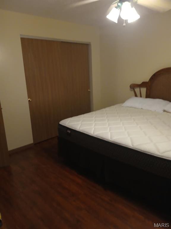 10506 Camden Park Dr, Saint Louis, MO 63135 - bedroom featuring dark wood finished floors, ceiling fan, and baseboards