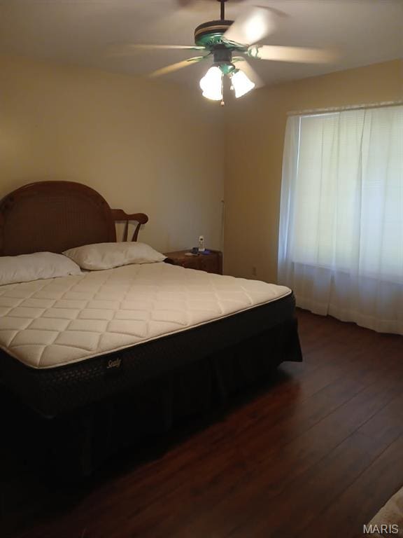10506 Camden Park Dr, Saint Louis, MO 63135 - bedroom featuring dark wood-style floors and ceiling fan