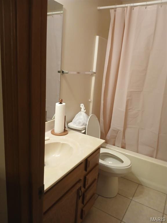 10506 Camden Park Dr, Saint Louis, MO 63135 - bathroom featuring tile patterned floors, vanity, shower / tub combo, and toilet
