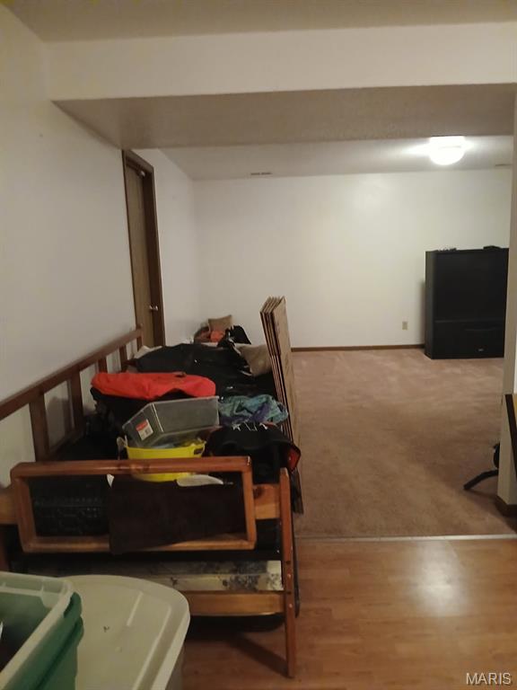 10506 Camden Park Dr, Saint Louis, MO 63135 - finished basement featuring carpet and wood finished floors