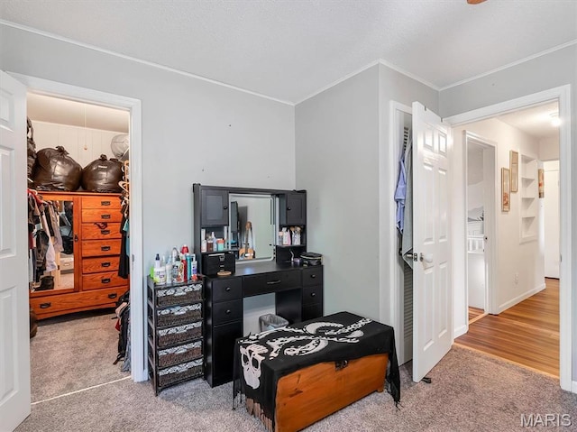 1101 Sunset Dr, Sullivan, MO 63080 - bedroom with light colored carpet, a walk in closet, ornamental molding, and a closet