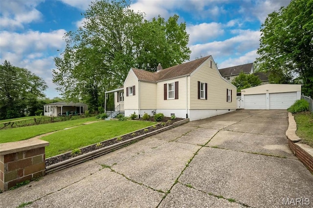 126 E Waymire Ave, Saint Louis, MO 63119 - view of side of home with an outbuilding, a garage, a lawn, and a chimney