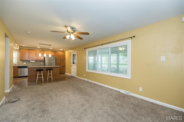 126 E Waymire Ave, Saint Louis, MO 63119 - living area featuring a ceiling fan, light carpet, baseboards, and recessed lighting
