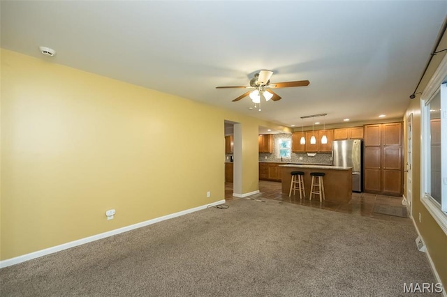 126 E Waymire Ave, Saint Louis, MO 63119 - unfurnished living room featuring recessed lighting, ceiling fan, baseboards, and carpet floors