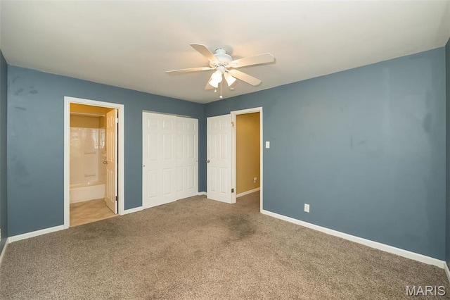 126 E Waymire Ave, Saint Louis, MO 63119 - unfurnished bedroom with carpet, baseboards, a closet, ensuite bath, and a ceiling fan