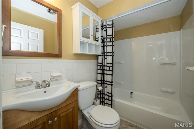 126 E Waymire Ave, Saint Louis, MO 63119 - full bath with toilet, vanity, shower / bathtub combination with curtain, tile walls, and tile patterned flooring