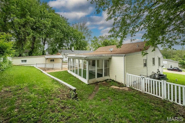 126 E Waymire Ave, Saint Louis, MO 63119 - rear view of house with a sunroom and a wooden deck