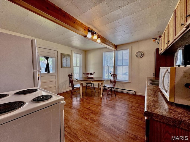 274 Cornelison St, Lebanon, MO 65536 - kitchen with white appliances, wood finished floors, beamed ceiling, dark countertops, and a baseboard heating unit